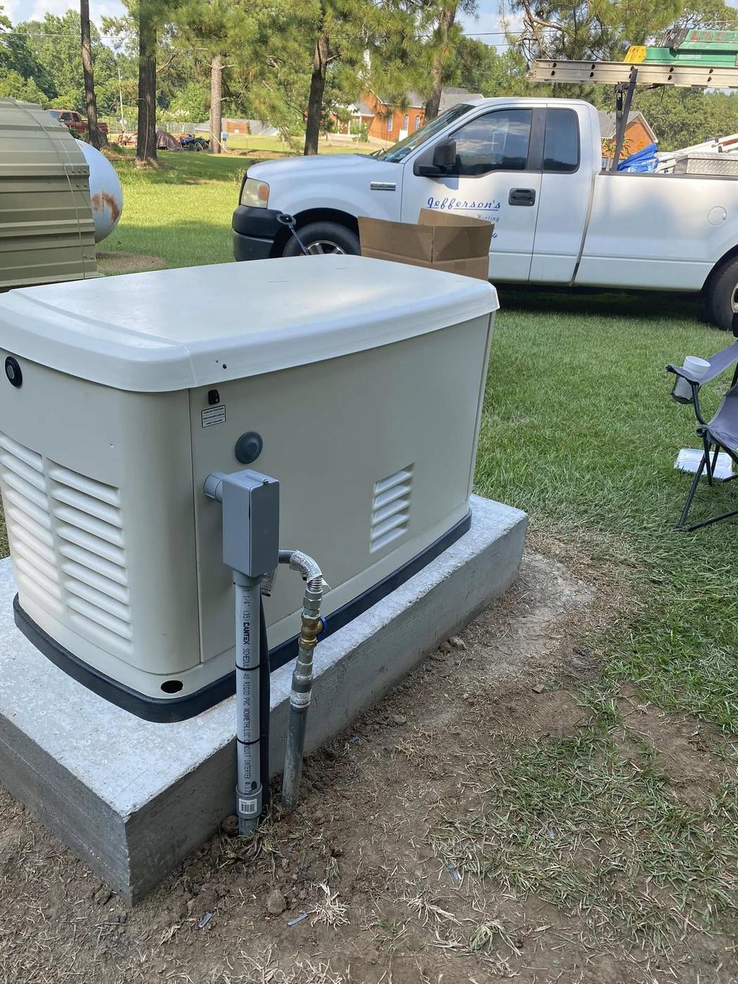 Jefferson's AC & Electrical work truck on a jobsite